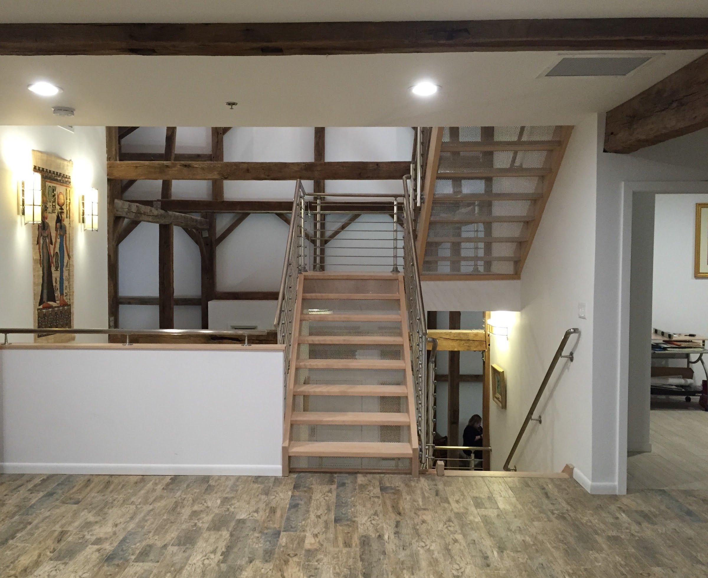 Stair and timber framing inside a repurposed barn designed by Kurt J. Ludwig, AIA