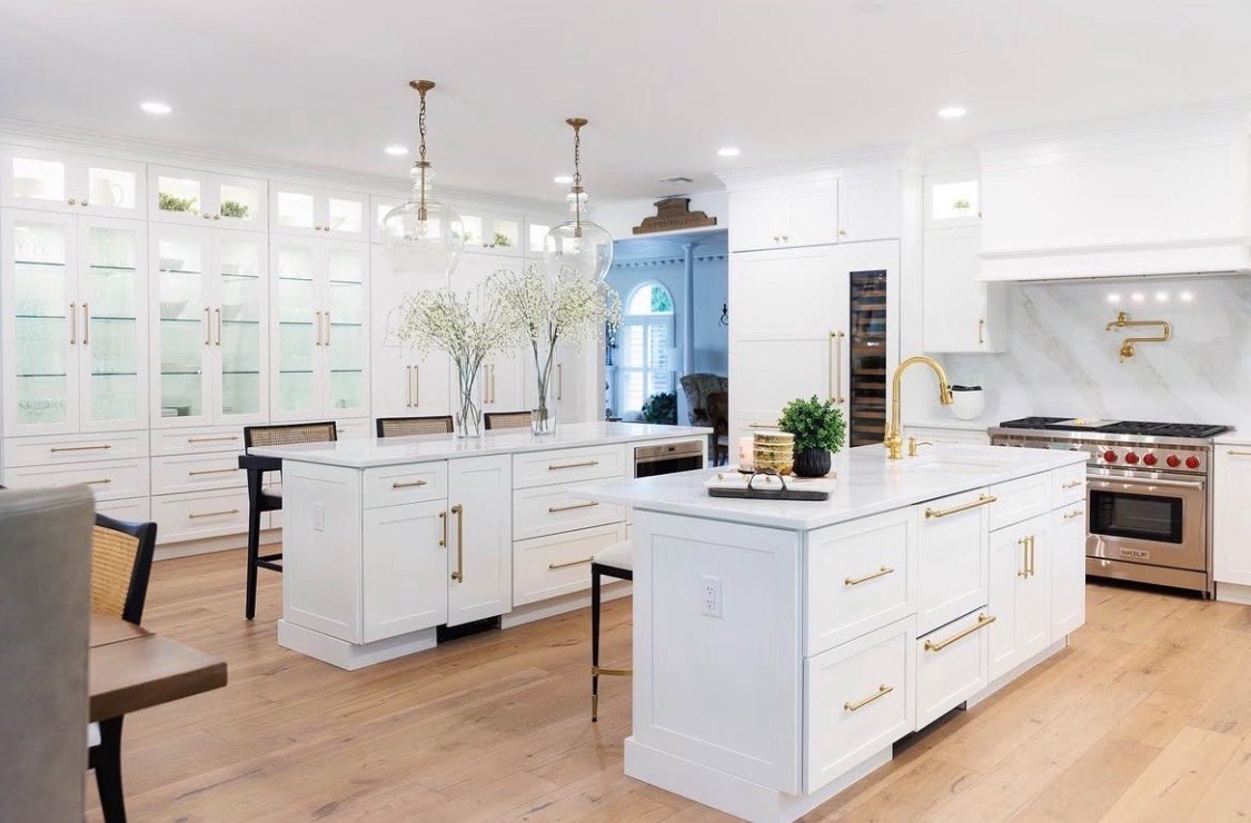 White kitchen renovation with island by Kurt J. Ludwig, AIA